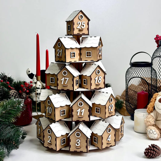 Wooden advent calendar with snow-covered houses on a white background