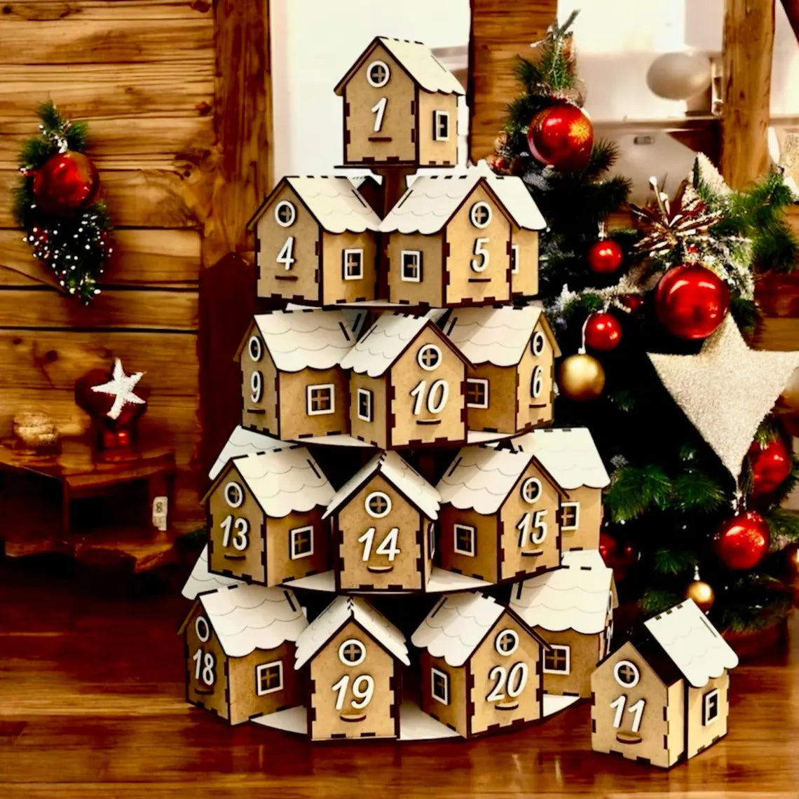 Wooden advent calendar shaped like a Christmas village with houses stacked in a pyramid formation, decorated with numbers and snow effects.
