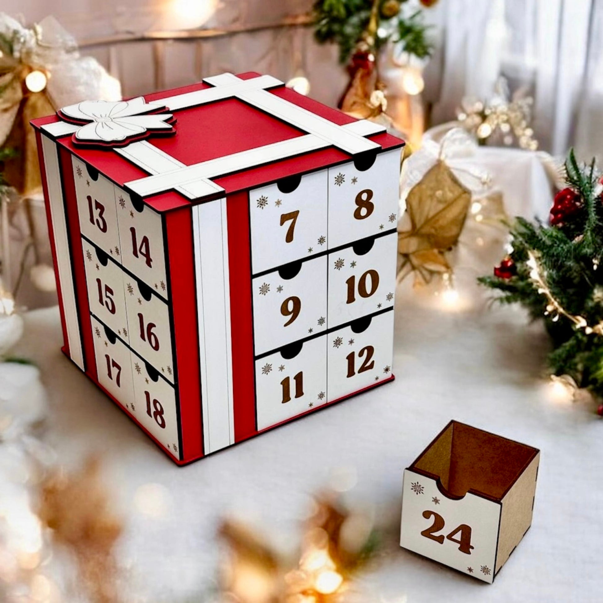 Advent calendar with drawers and a small wooden box labeled '24' on a festive background.