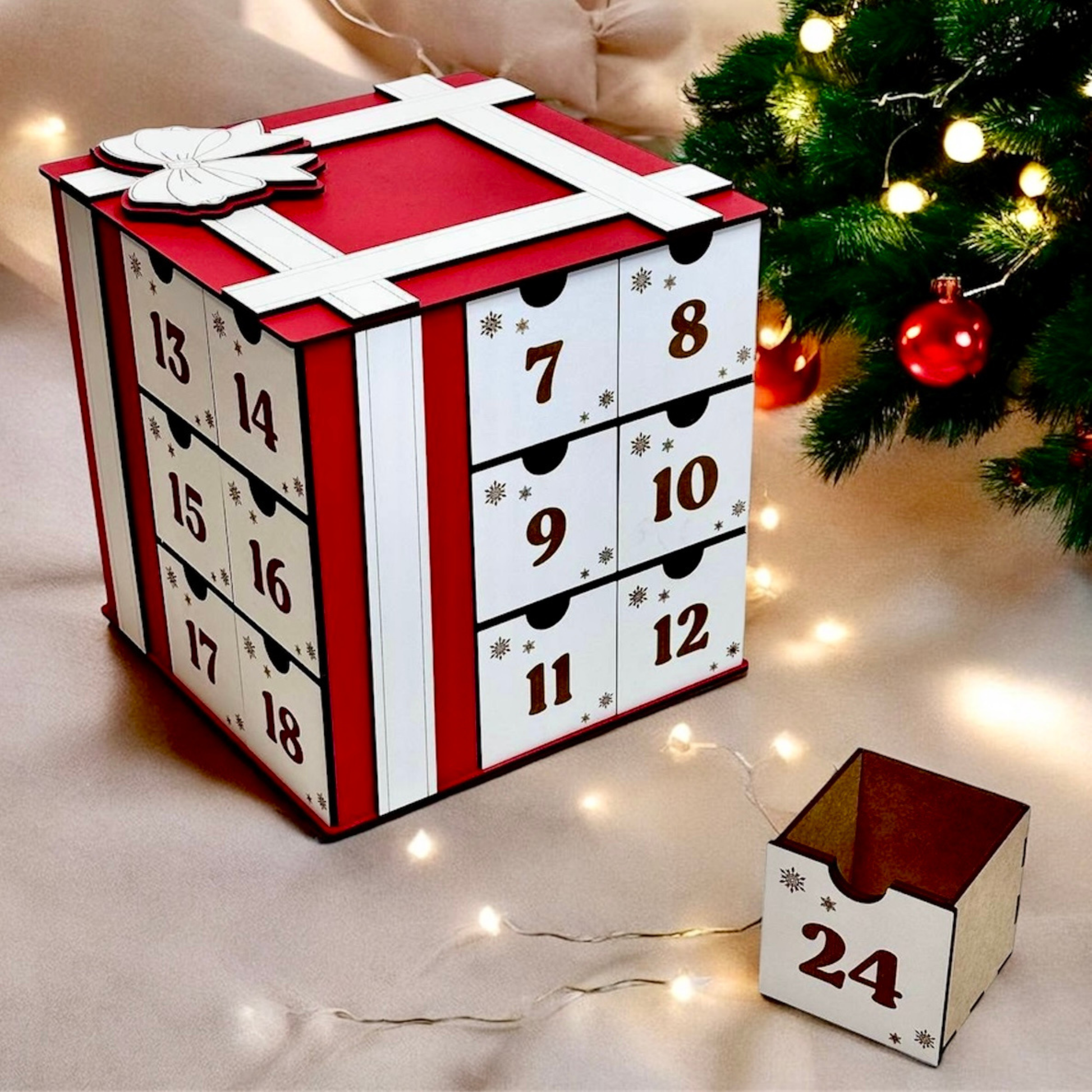 Advent calendar with numbered drawers under a Christmas tree