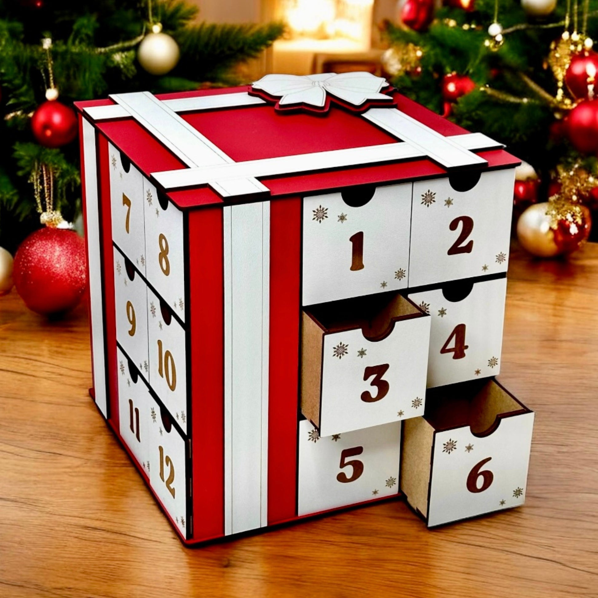 Advent calendar with red and white design on a wooden surface with Christmas decorations in the background.