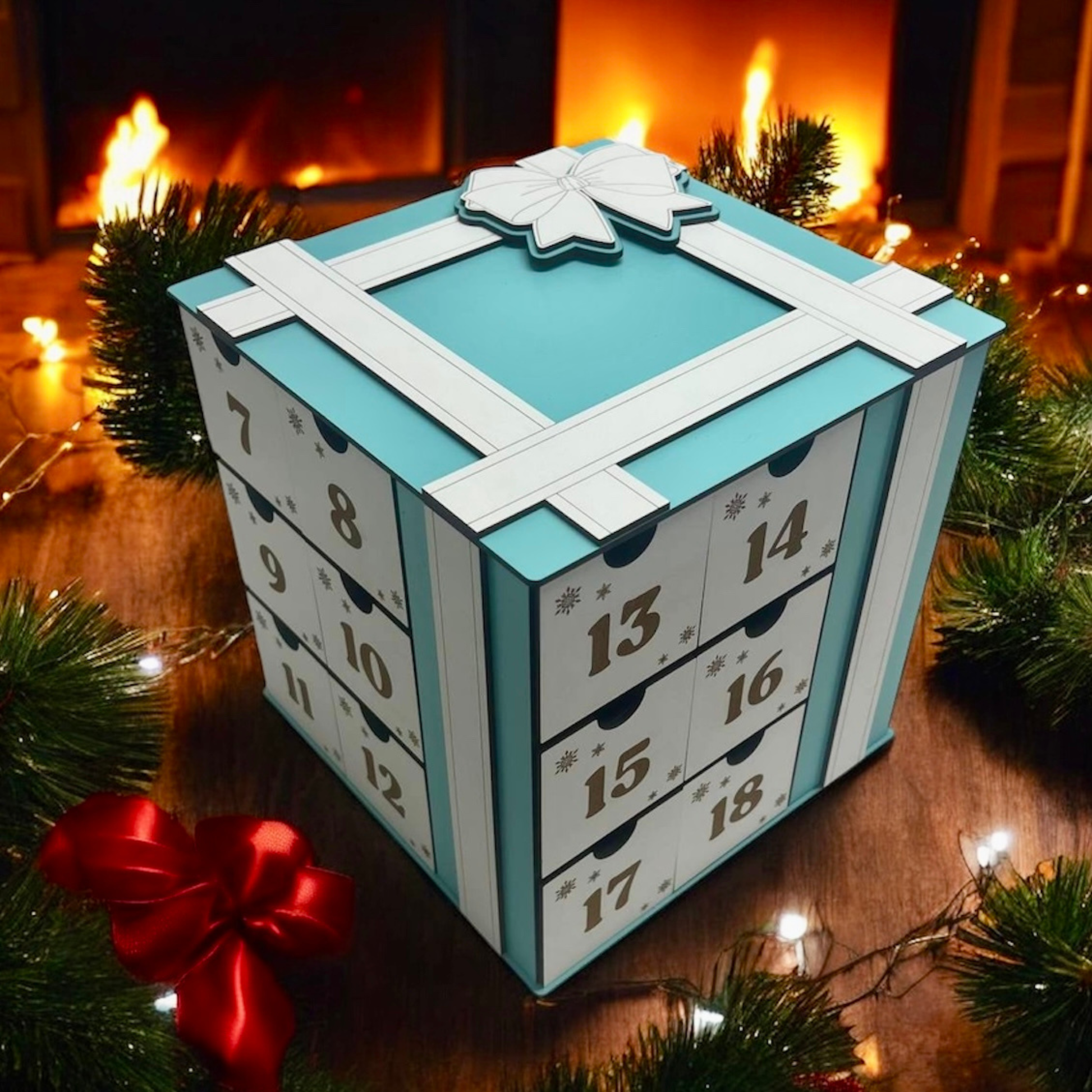 Advent calendar with a blue and white design, surrounded by Christmas decorations.