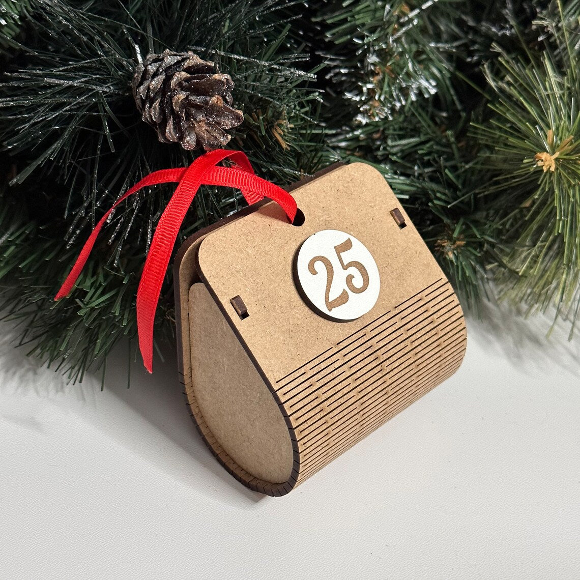 Advent calendar for Christmas holidays in the shape of a Christmas tree, made of wood