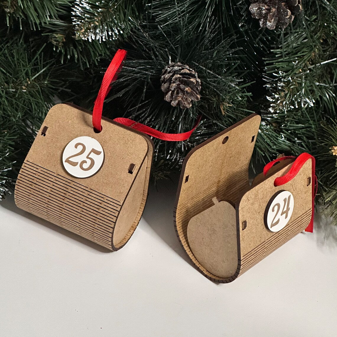 Advent calendar for Christmas holidays in the shape of a Christmas tree, made of wood