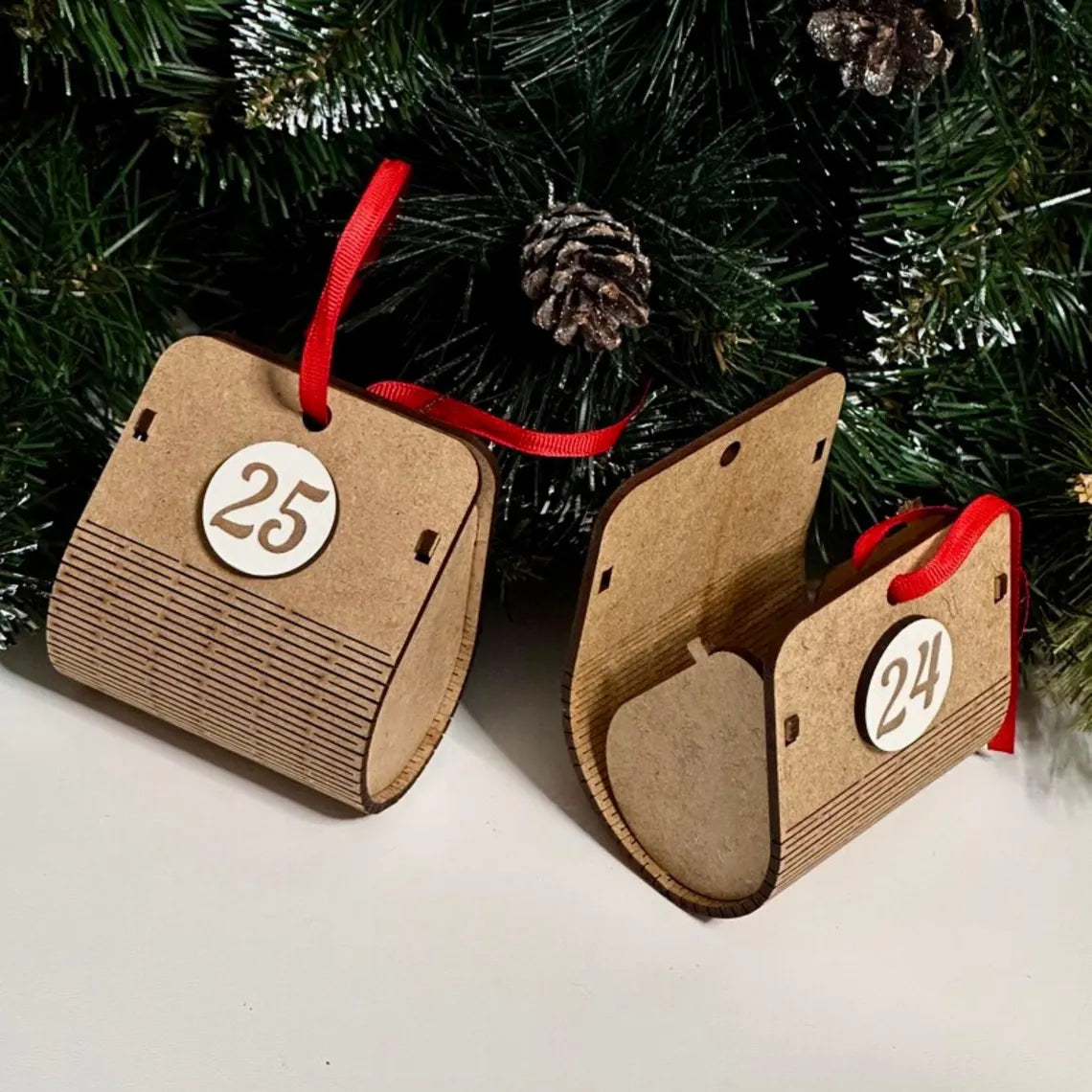 Advent calendar for Christmas holidays in the shape of a Christmas tree, made of wood