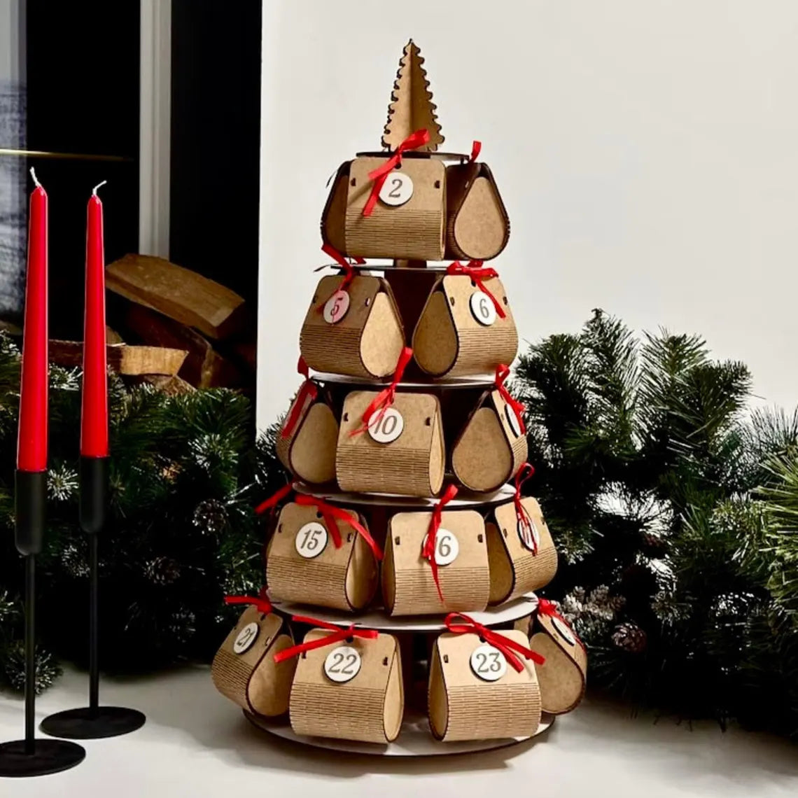 Wooden advent calendar with red ribbons and candles in a festive setting