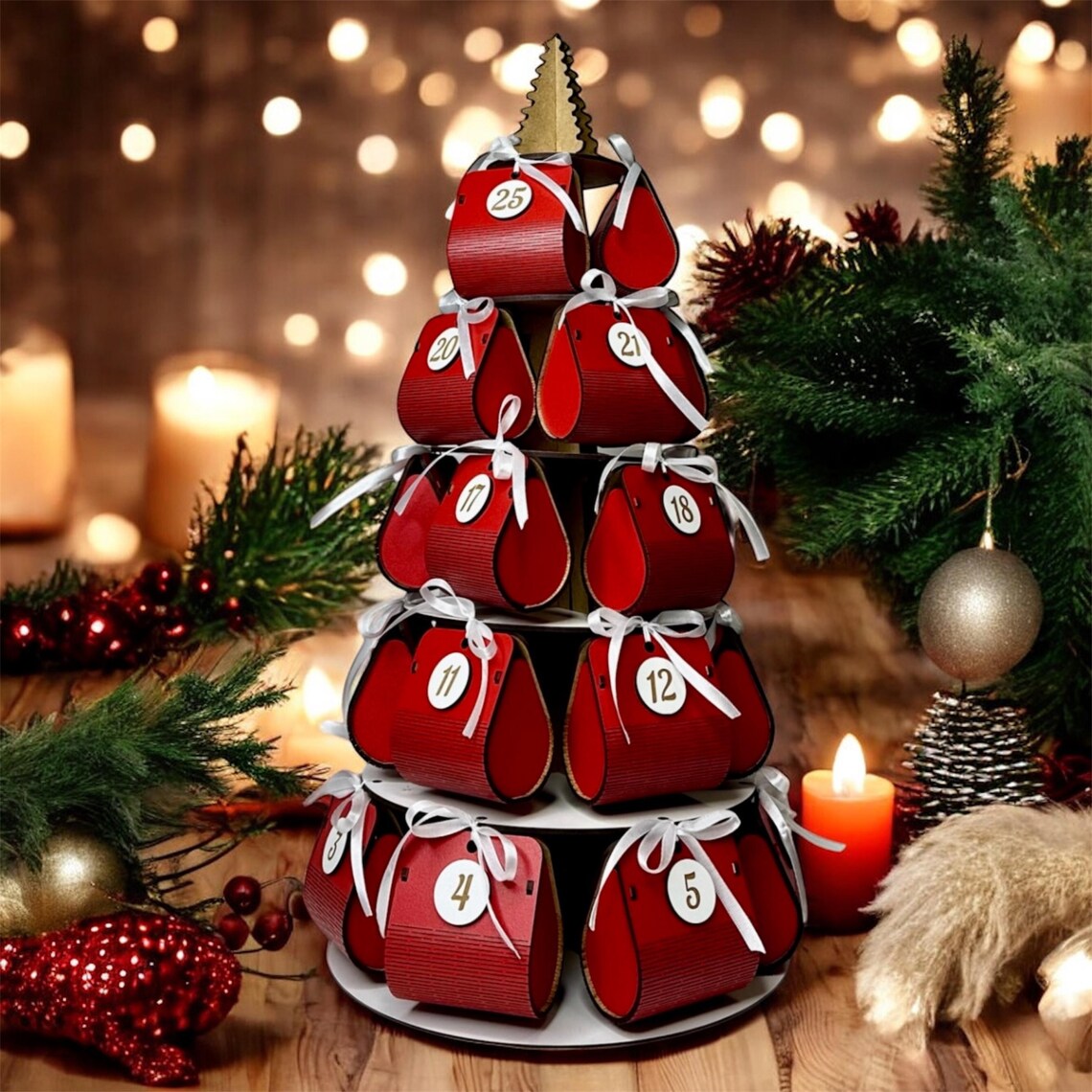 Advent calendar with red boxes on a wooden table with Christmas decorations.