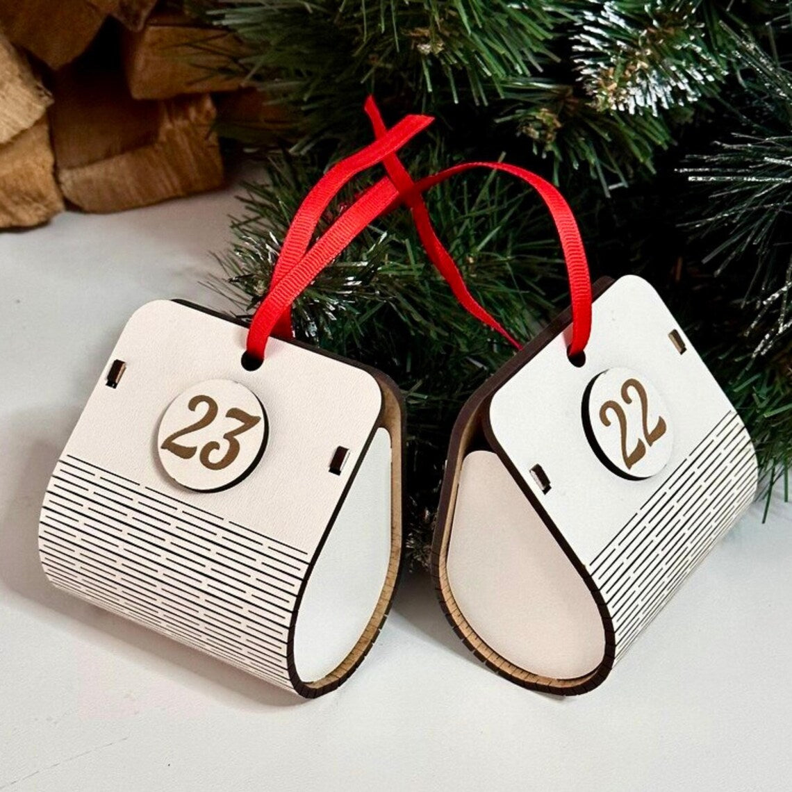 white wooden Advent calendar in the shape of a Christmas tree with spacious boxes