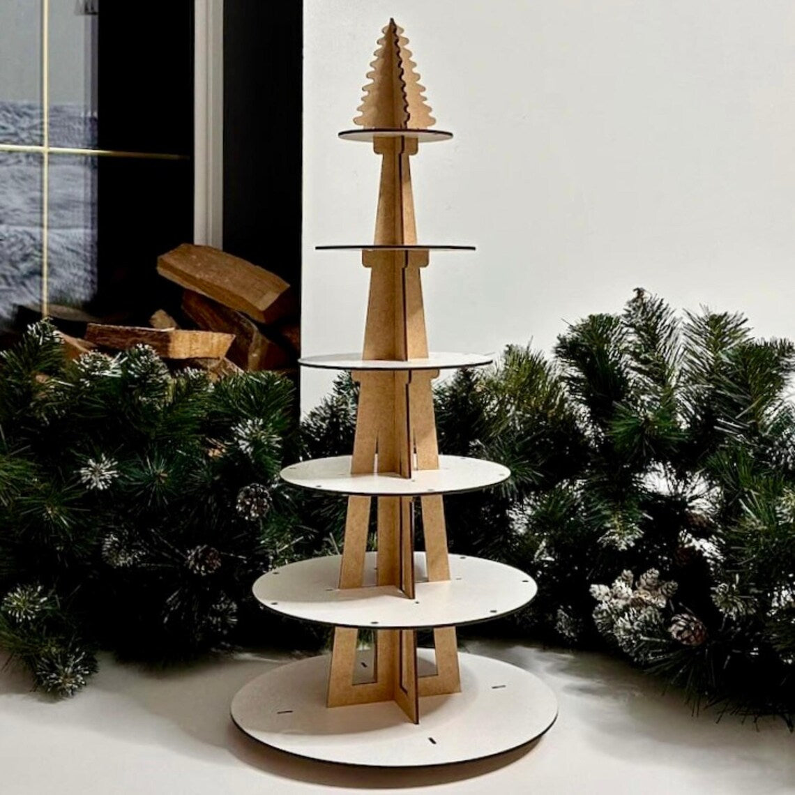 Wooden Christmas tree stand with white circular base against a festive background