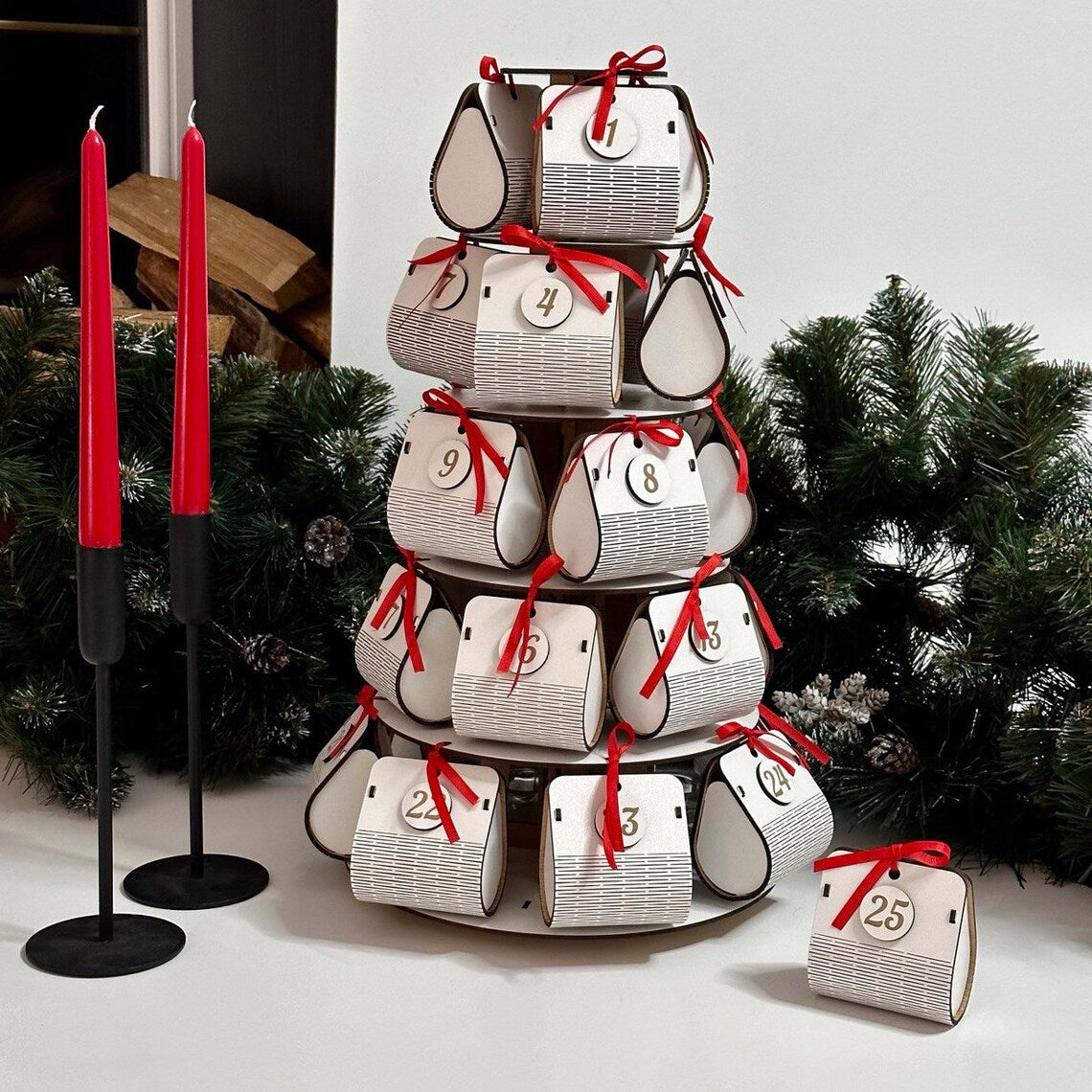 white wooden Advent calendar in the shape of a Christmas tree with spacious boxes