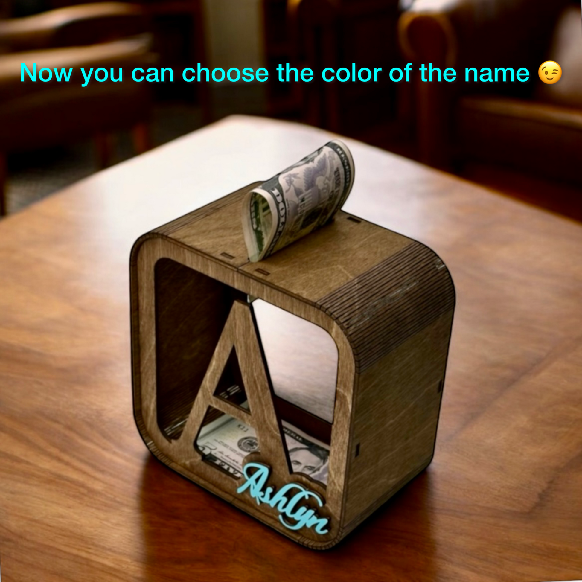 Wooden cube with money and personalized name on a wooden table