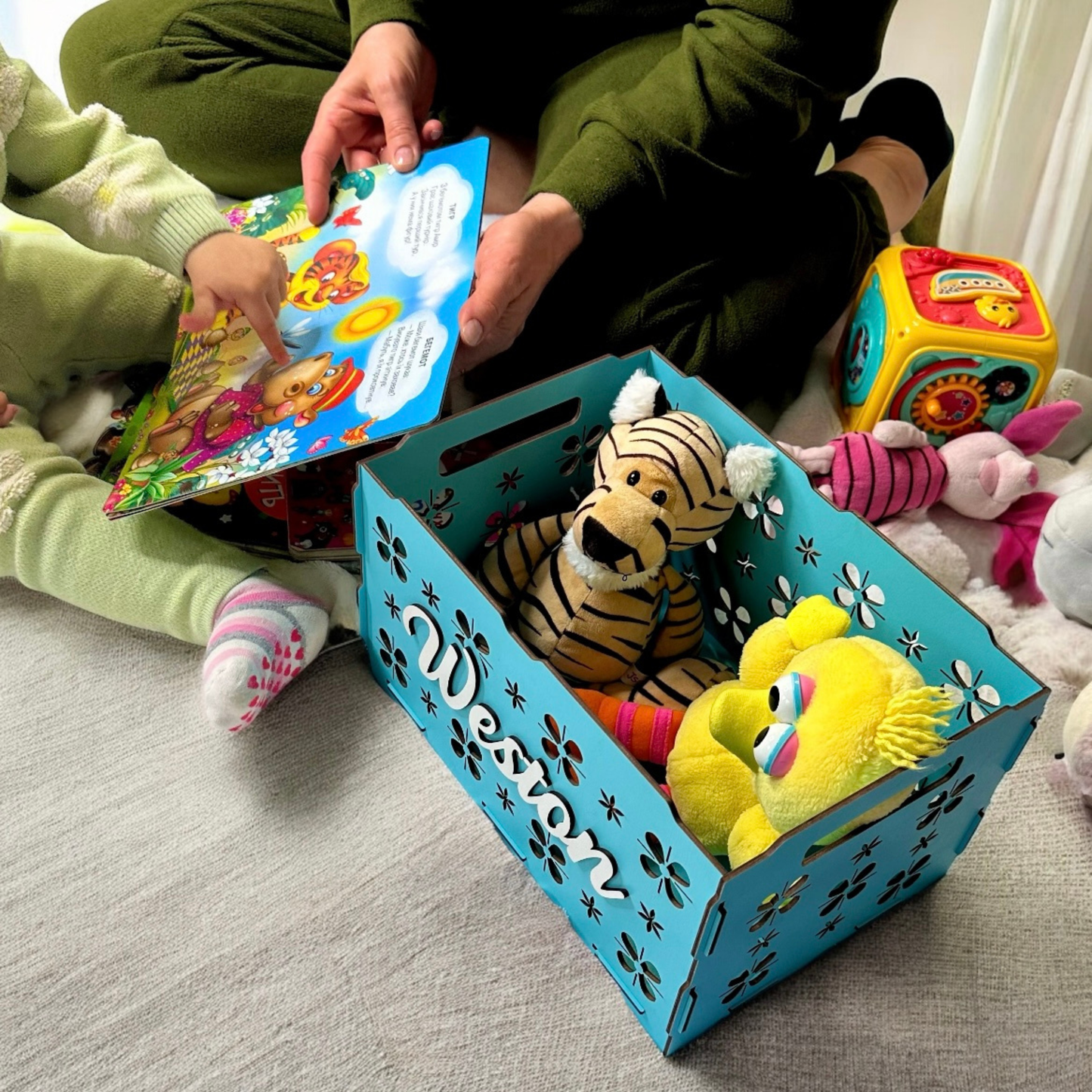 personalized wooden toy box for children, beautifully carved, with toys inside