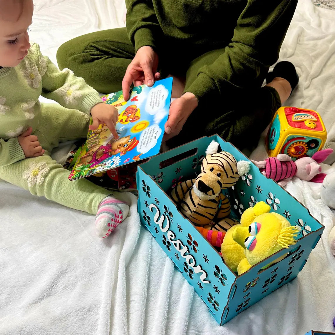 personalized wooden toy box for children, beautifully carved, with toys inside