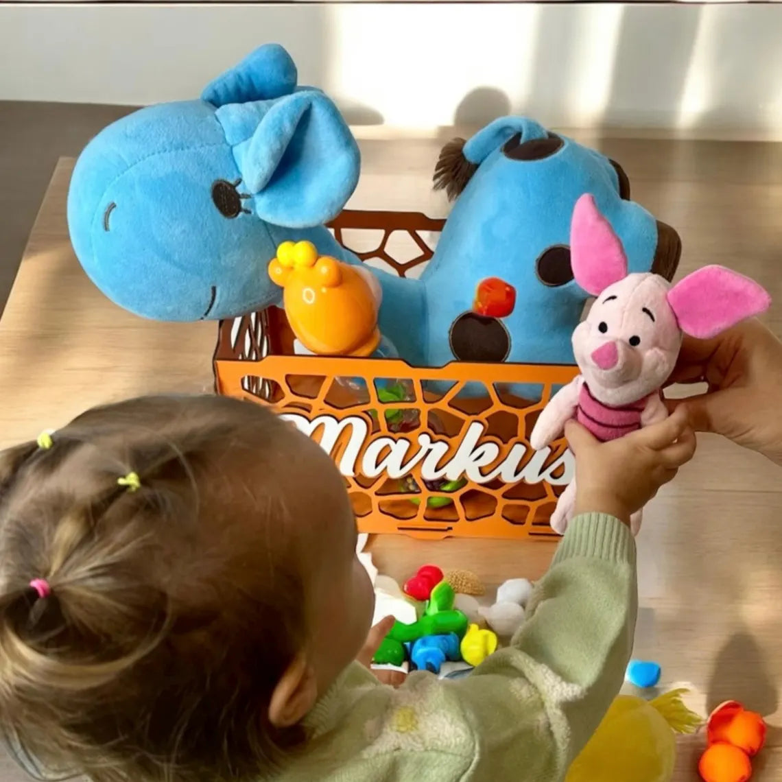 personalized wooden toy box for children, beautifully carved, with toys inside