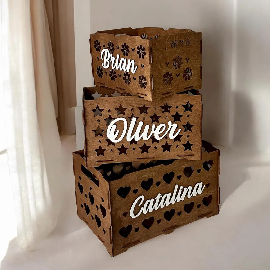 personalized wooden toy box for children, beautifully carved, with toys inside