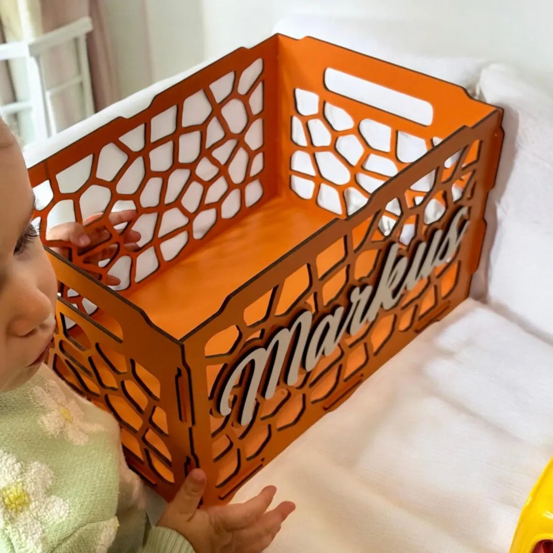 personalized wooden toy box for children, beautifully carved, with toys inside